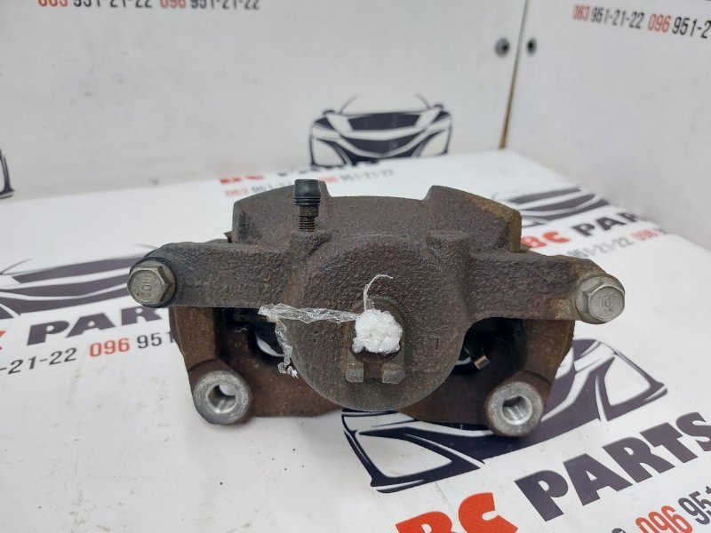 Суппорт тормозной передний левый Rogue 2017 T32 QR25 2.5