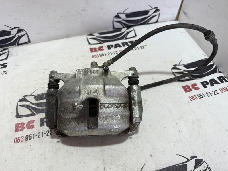 Суппорт тормозной передний левый Nissan Rogue 2013-2020 T32 410114BT0A Б/У