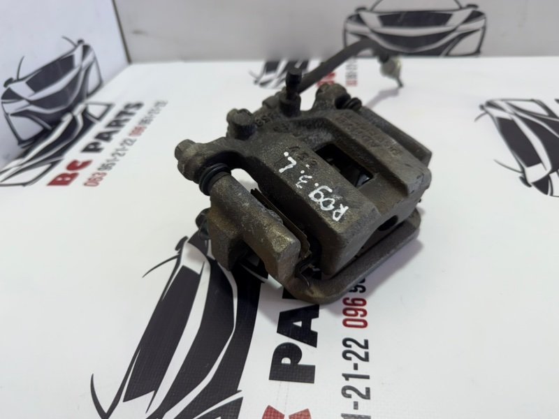 Суппорт тормозной задний правый Rogue 2013-2020 T32