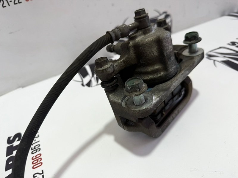 Суппорт тормозной задний правый Rogue 2013-2020 T32