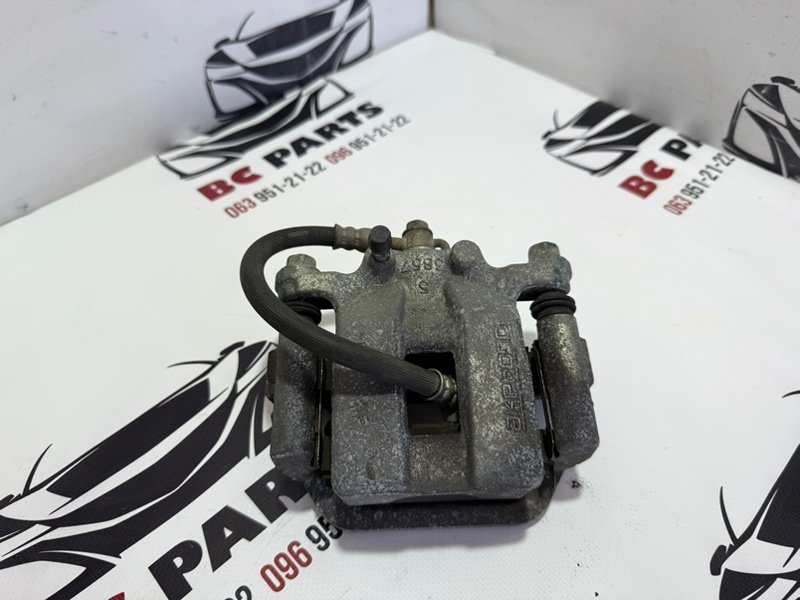 Суппорт тормозной задний левый Nissan Rogue 2013-2020 T32 44011-4CA0B Б/У