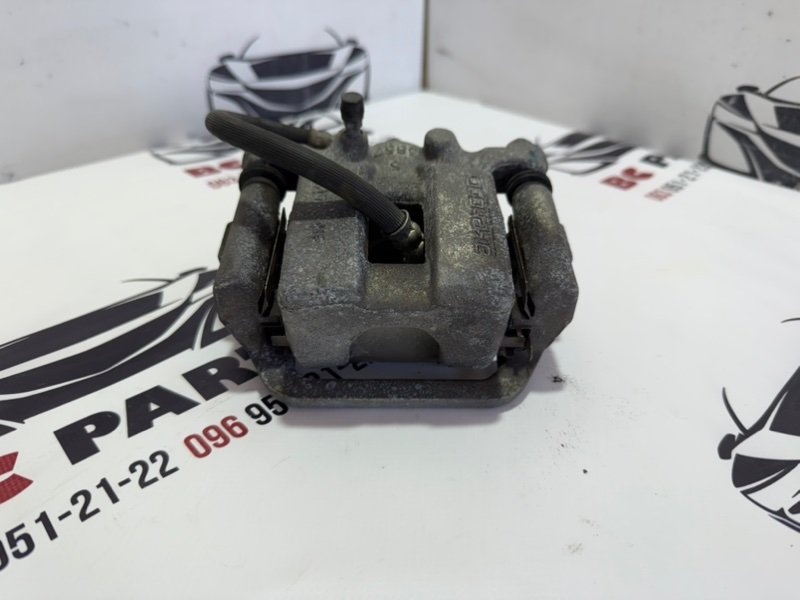 Суппорт тормозной задний левый Rogue 2013-2020 T32