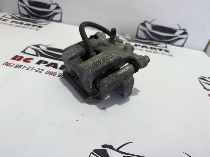 Суппорт тормозной задний левый Nissan Rogue T32