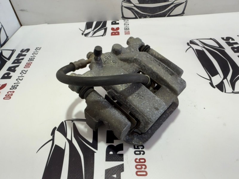 Суппорт тормозной задний левый Rogue 2013-2020 T32