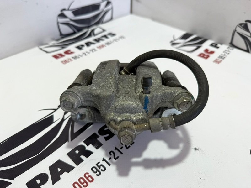 Суппорт тормозной задний левый Rogue 2013-2020 T32