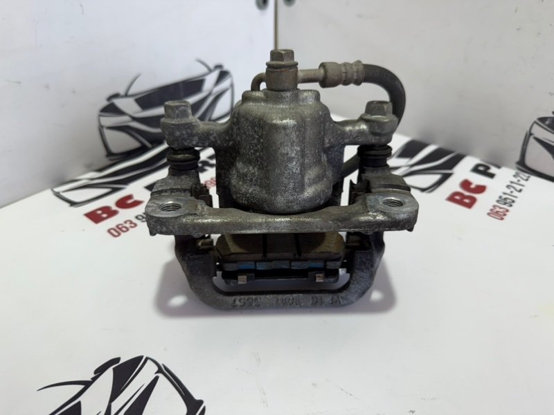 Суппорт тормозной задний левый Rogue 2013-2020 T32