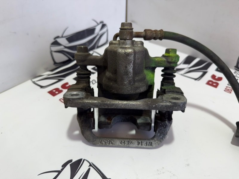 Суппорт тормозной задний левый Rogue 2013-2020 T32