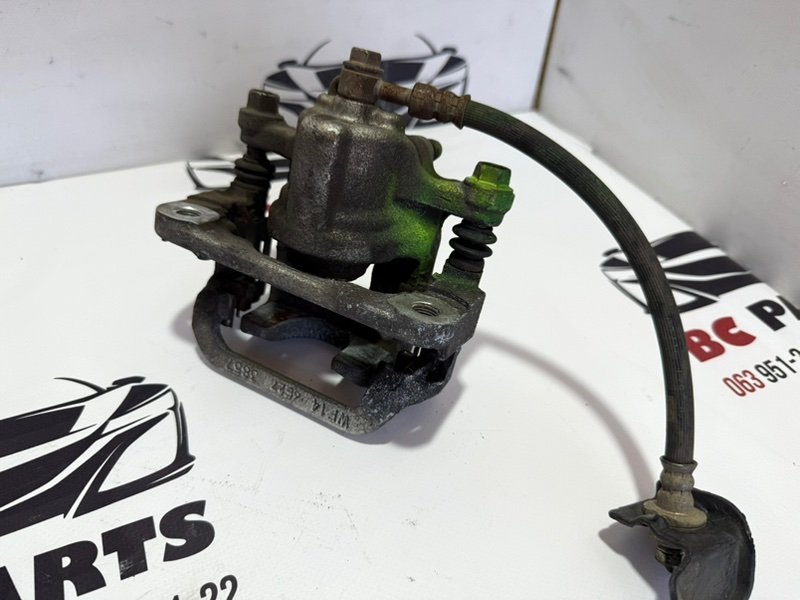 Суппорт тормозной задний левый Rogue 2013-2020 T32