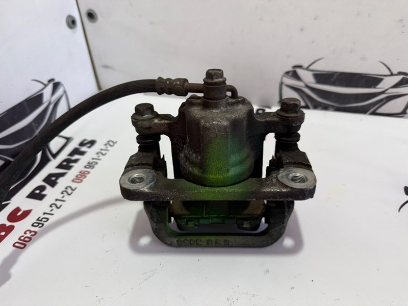 Суппорт тормозной задний правый Rogue 2013-2020 T32