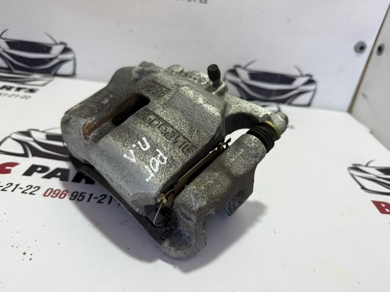 Суппорт тормозной передний левый Rogue 2013-2020 T32