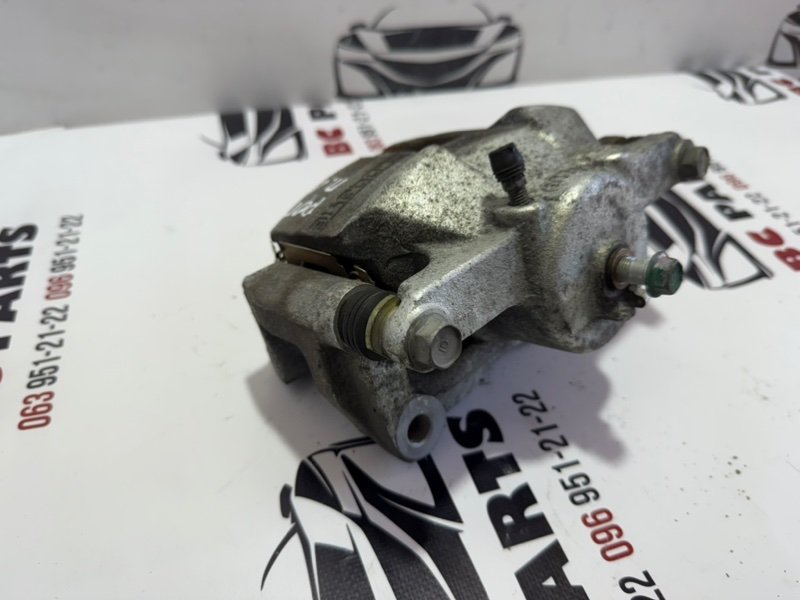 Суппорт тормозной передний левый Rogue 2013-2020 T32