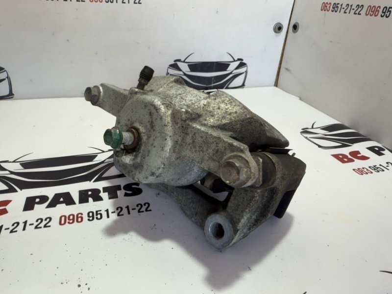 Суппорт тормозной передний левый Rogue 2013-2020 T32