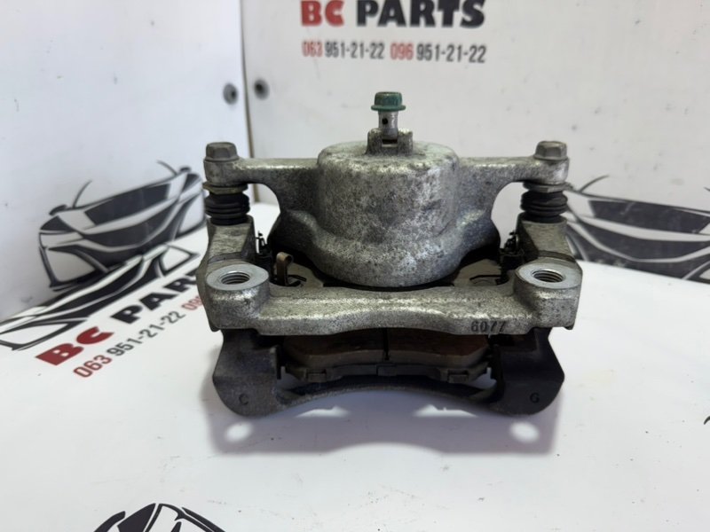 Суппорт тормозной передний левый Rogue 2013-2020 T32