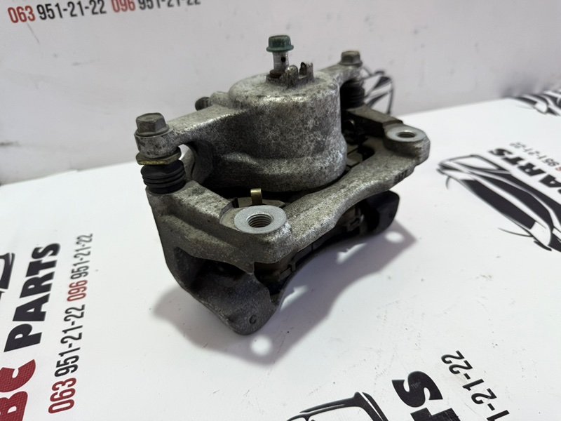 Суппорт тормозной передний левый Rogue 2013-2020 T32