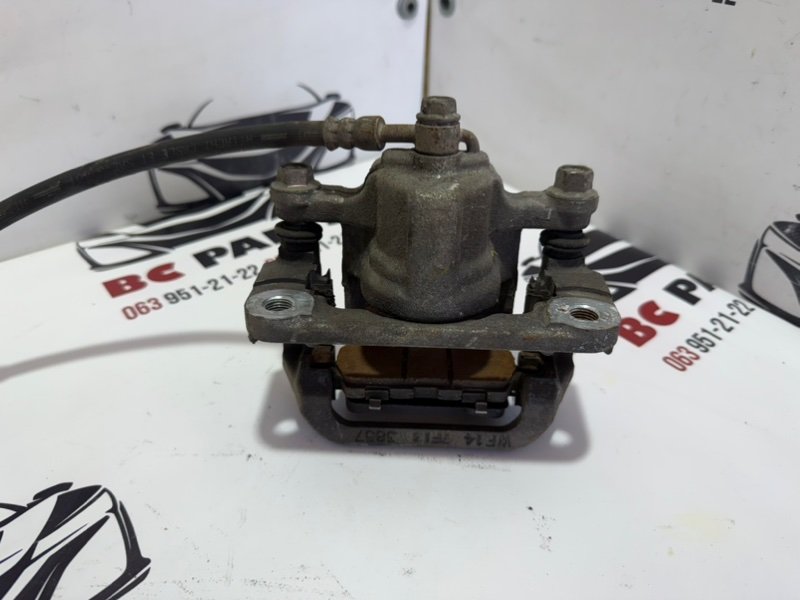 Суппорт тормозной задний правый Rogue 2013-2020 T32