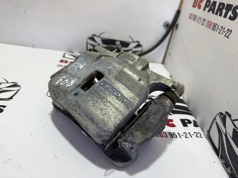 Суппорт тормозной передний правый Nissan Rogue T32 Суппорт тормозной передний правый Nissan Rogue T32