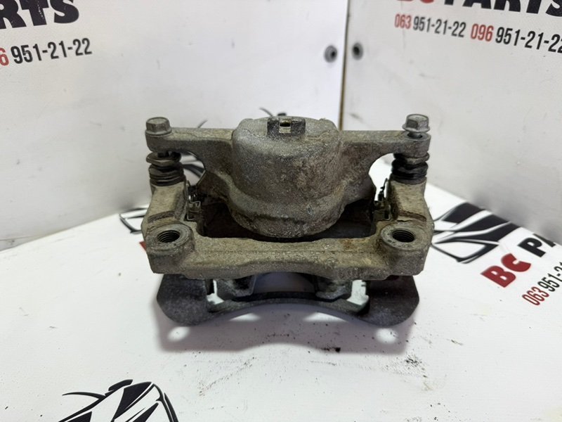 Суппорт тормозной передний правый Rogue 2013-2020 T32