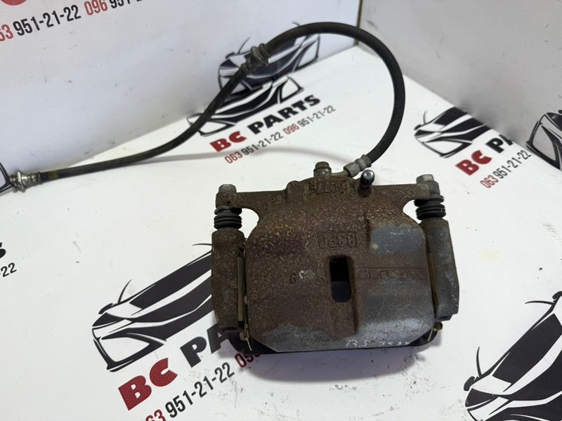 Суппорт тормозной передний левый Nissan Rogue Sport 2013-2020 J11 410114BT0A Б/У