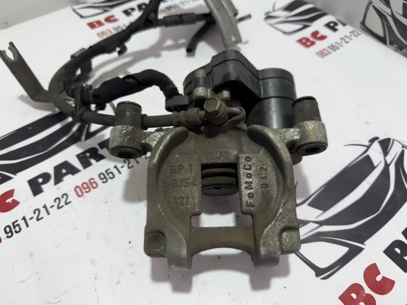 Запчасть суппорт тормозной задний левый Ford Fusion 2013-2020 MK5 DG9Z2553B Б/У Суппорт тормозной задний левый Ford Fusion 2013-2020 MK5 DG9Z2553B Б/У