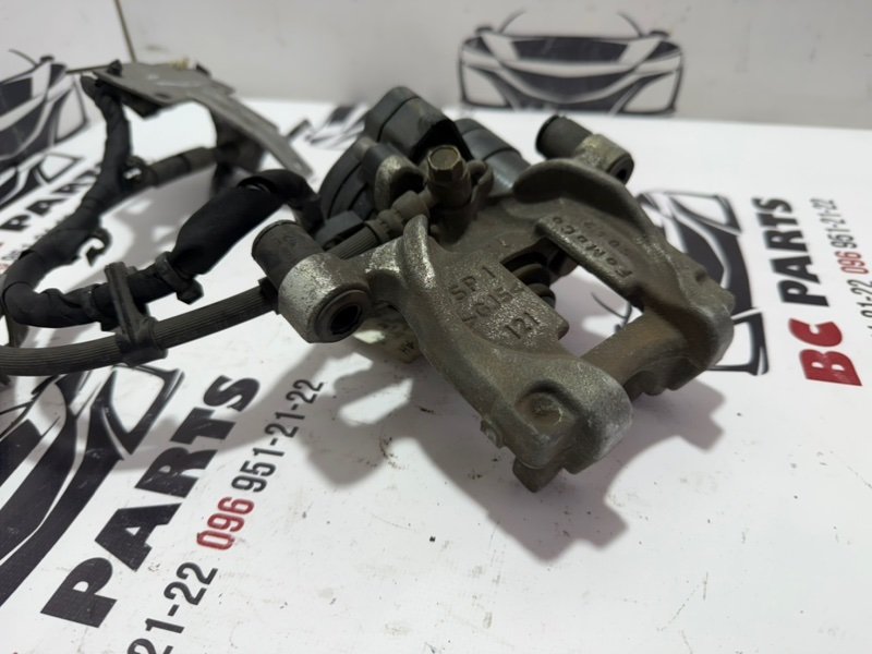 Суппорт тормозной задний левый Ford Fusion MK5 Суппорт тормозной задний левый Ford Fusion MK5