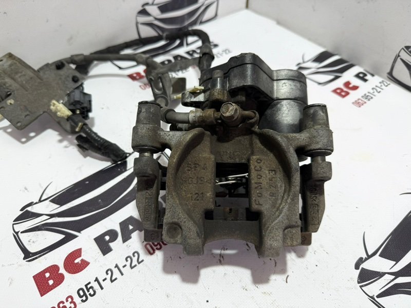Суппорт тормозной задний левый Ford Fusion 2013-2020 MK5 DG9Z2553B Б/У