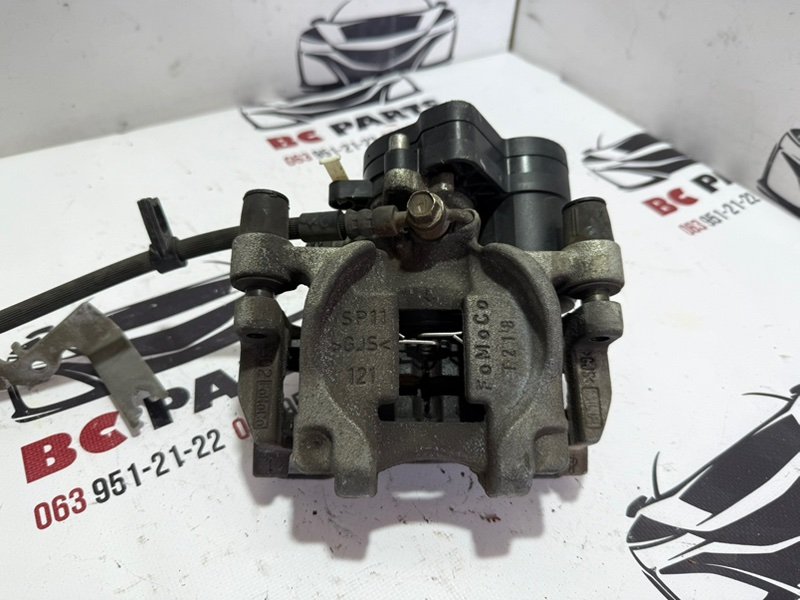 Суппорт тормозной задний левый Ford Fusion 2013-2020 MK5 DG9Z2553B Б/У