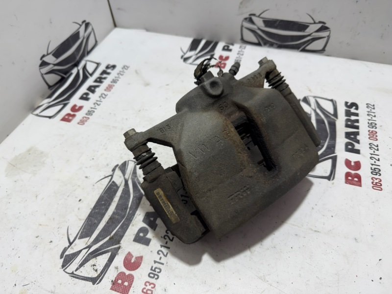 Суппорт тормозной передний левый Volkswagen Tiguan 2.0