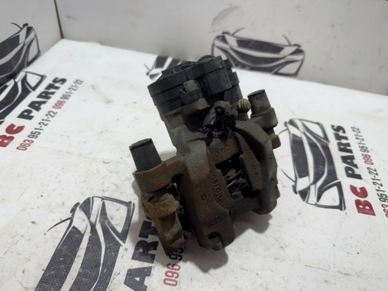 Суппорт тормозной задний левый Volkswagen Tiguan 2.0