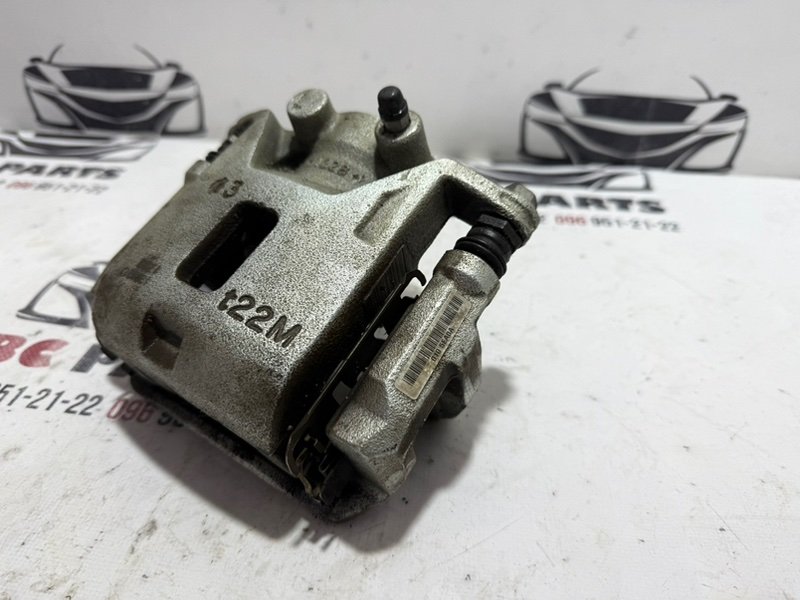 Суппорт тормозной передний левый Kicks 2021 1.6