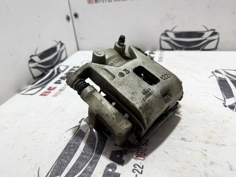 Суппорт тормозной передний левый Nissan Kicks 1.6