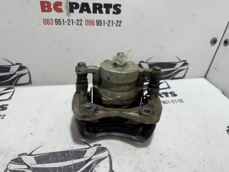 Суппорт тормозной передний левый Kicks 2021 1.6