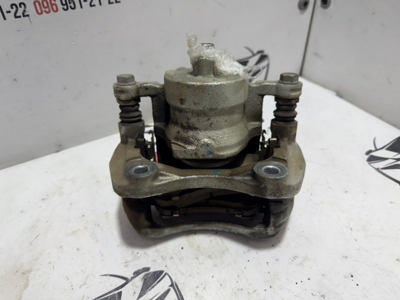 Суппорт тормозной передний правый Kicks 2021 1.6