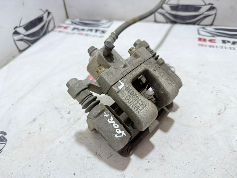 Суппорт тормозной задний левый Sportage 2017