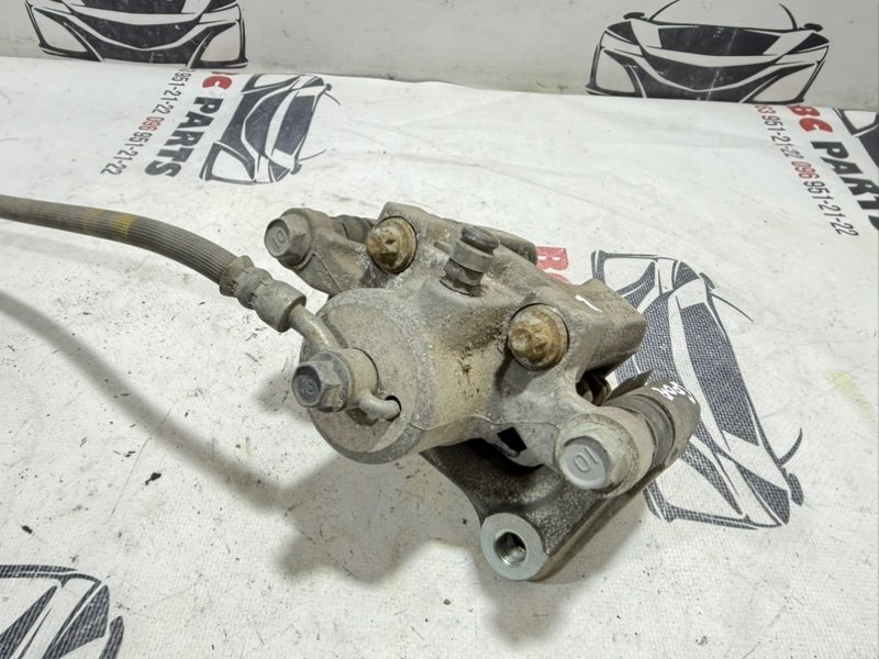 Суппорт тормозной задний левый Sportage 2017