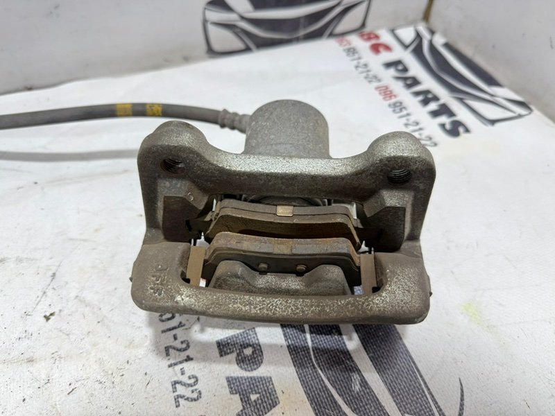 Суппорт тормозной задний левый Sportage 2017