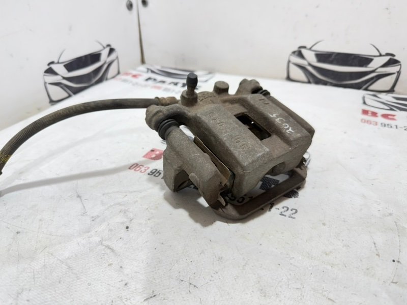 Суппорт тормозной задний левый Nissan Rogue T32 QR25 2.5