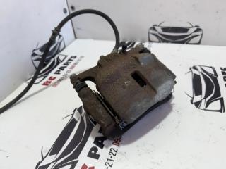 Суппорт тормозной передний левый Nissan Rogue Sport J11